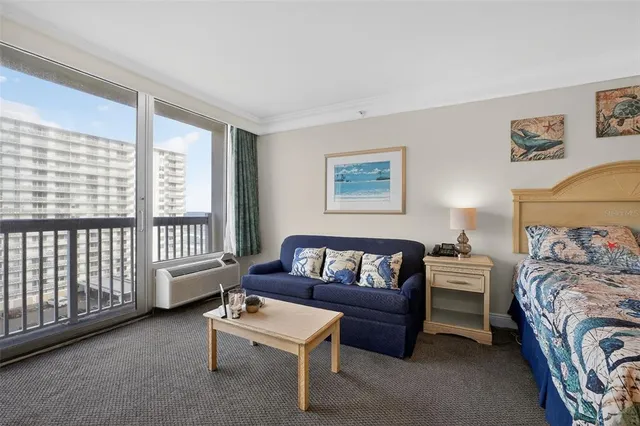 a kitchen with white cabinets and refrigerator