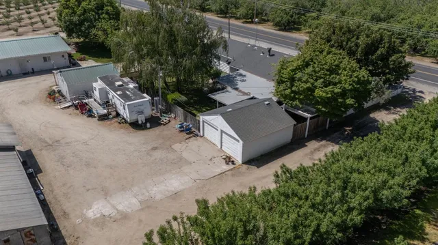 an aerial view of a house with outdoor space