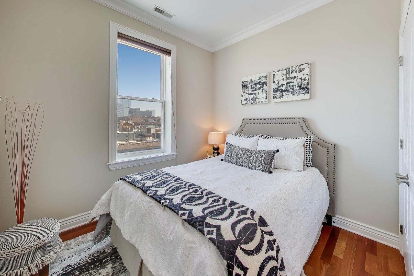 1148 West Monroe Street, Unit 5NE Chicago, IL 60607 - Photo 15 of 21 a bedroom with a bed and a window