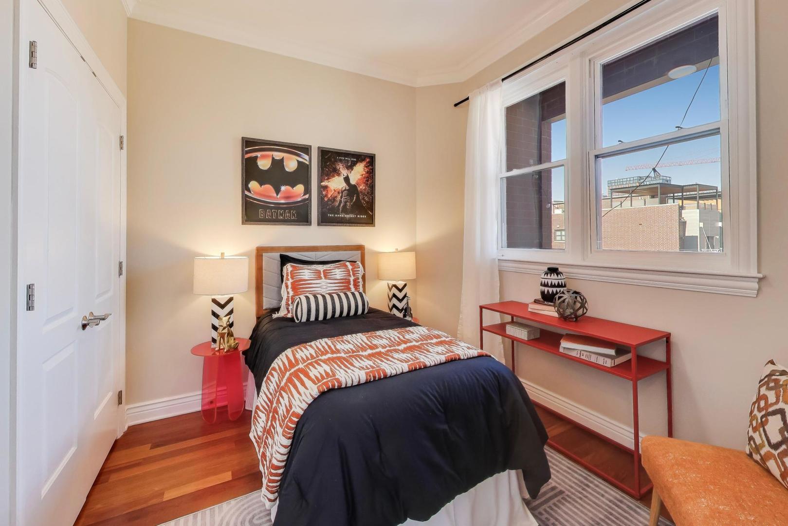 1148 West Monroe Street, Unit 5NE Chicago, IL 60607 - Photo 16 of 21 a bedroom with a bed and a window