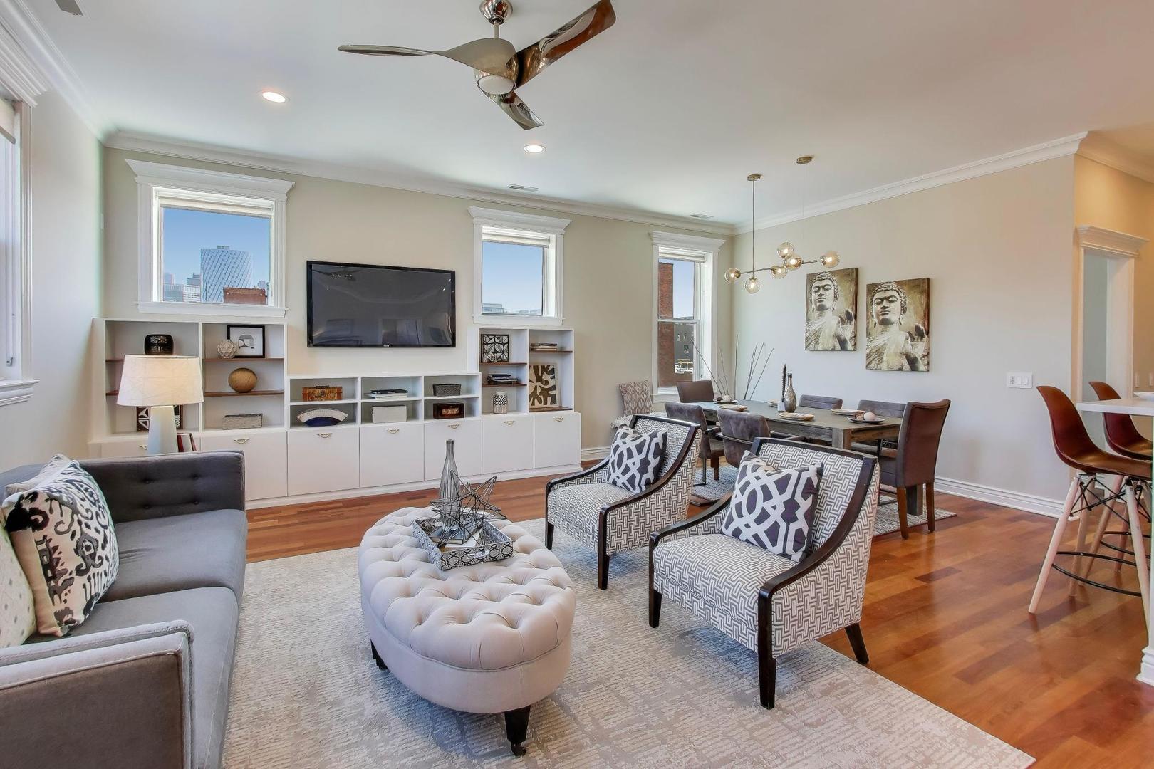 1148 West Monroe Street, Unit 5NE Chicago, IL 60607 - Photo 2 of 21 a living room with furniture and a flat screen tv