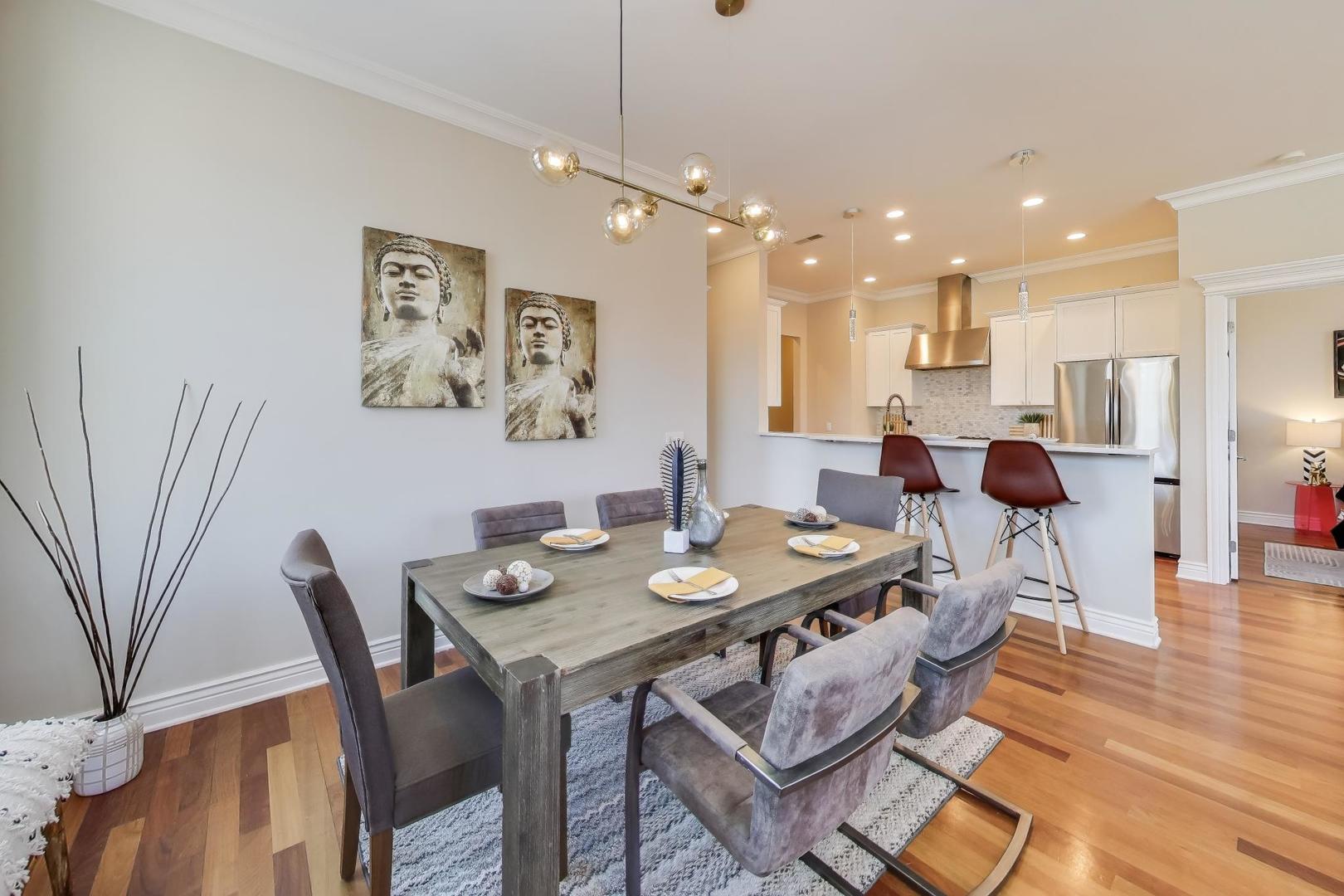 1148 West Monroe Street, Unit 5NE Chicago, IL 60607 - Photo 5 of 21 a view of a dining room with furniture and wooden floor