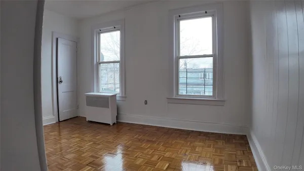 a view of a room with window and furniture
