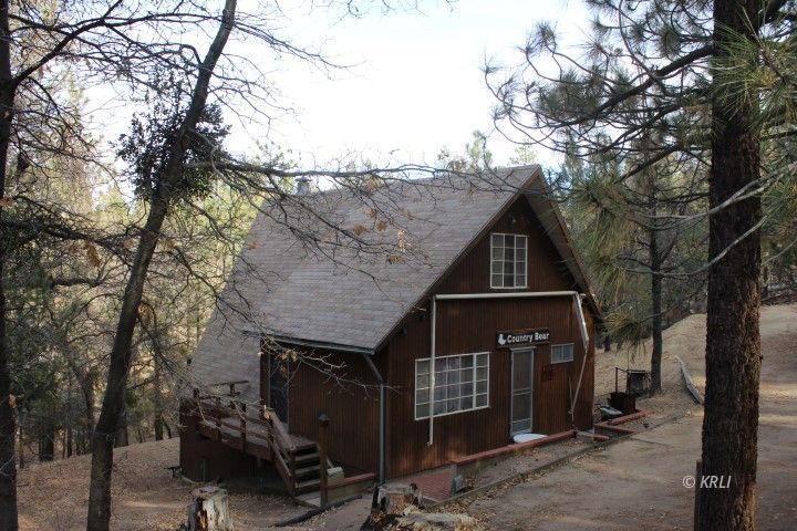 4288 Saddle Springs Road Weldon, CA 93283 - Photo 1 of 1 a front view of a house with parking area
