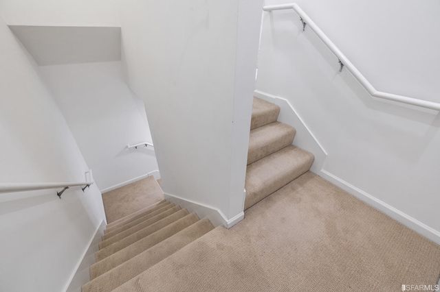 a view of a hallway with staircase