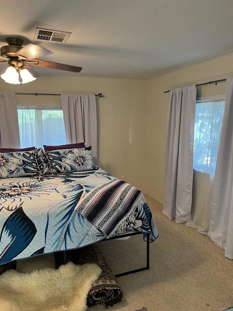 18218 Paradise Mountain Road, Unit SPACE 83 Valley Center, CA 92082 - Photo 12 of 50 a bedroom with bed and window