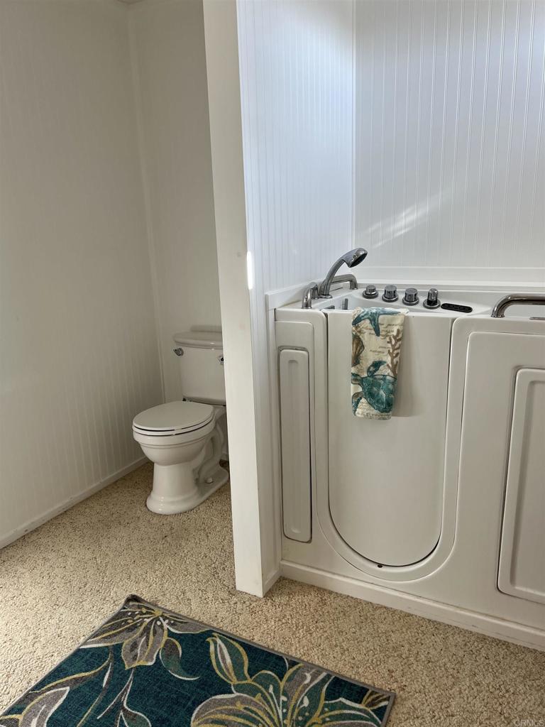18218 Paradise Mountain Road, Unit SPACE 83 Valley Center, CA 92082 - Photo 14 of 50 a bathroom with a sink and a mirror