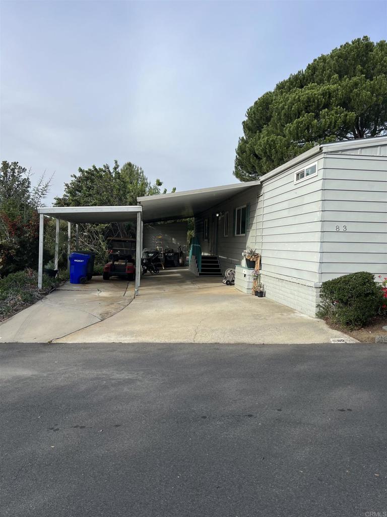 18218 Paradise Mountain Road, Unit SPACE 83 Valley Center, CA 92082 - Photo 36 of 50 a view of a parked car with garage