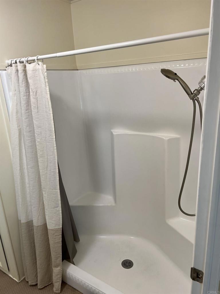 18218 Paradise Mountain Road, Unit SPACE 83 Valley Center, CA 92082 - Photo 5 of 50 a bathroom with a shower and a shower