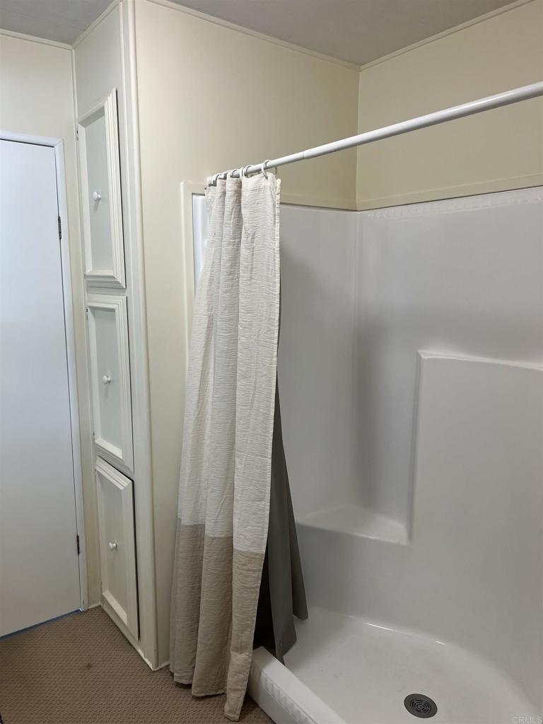 18218 Paradise Mountain Road, Unit SPACE 83 Valley Center, CA 92082 - Photo 6 of 50 a bathroom with a shower and a tub