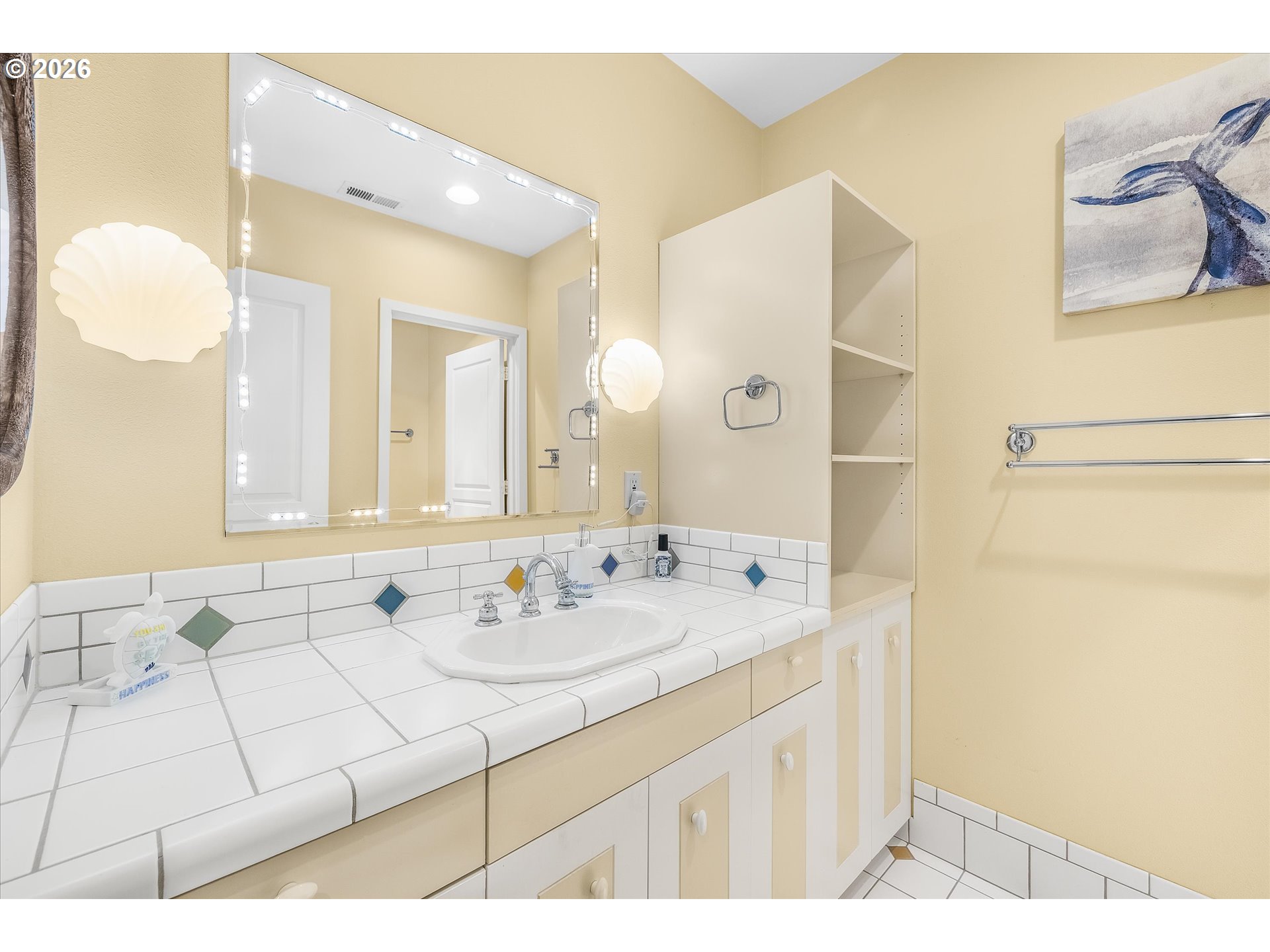438 Shellmidden Way Yachats, OR 97498 - Photo 27 of 40 a bathroom with a sink and a mirror