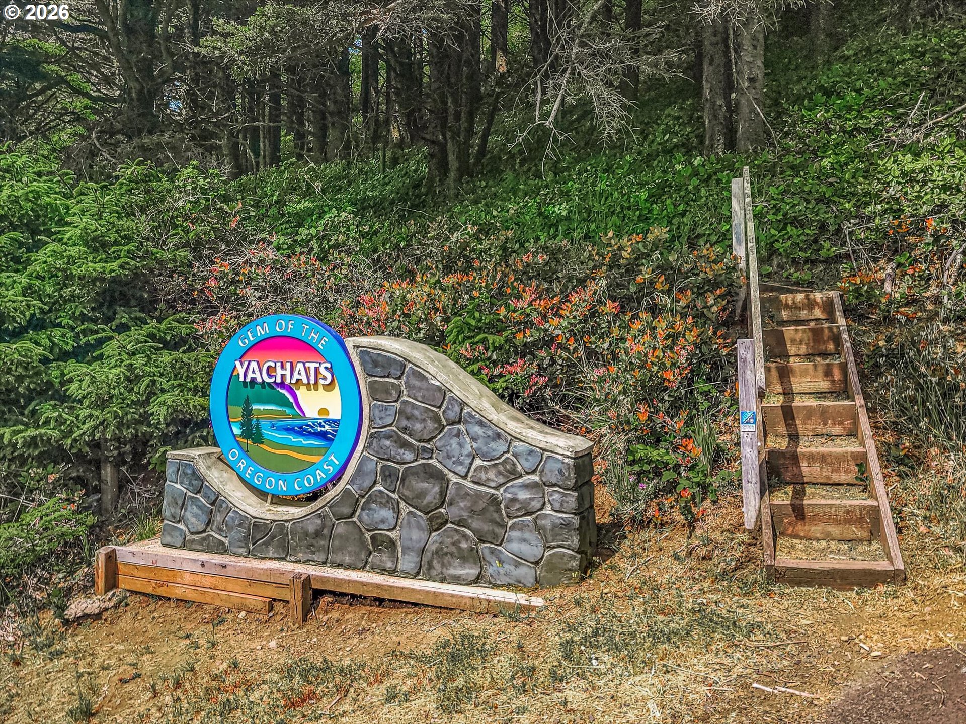 438 Shellmidden Way Yachats, OR 97498 - Photo 40 of 40 a sign that is on a brick wall