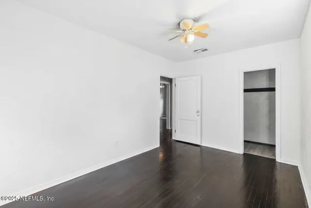 a view of walk in closet with living room