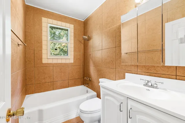 a kitchen with a stove a sink and a refrigerator