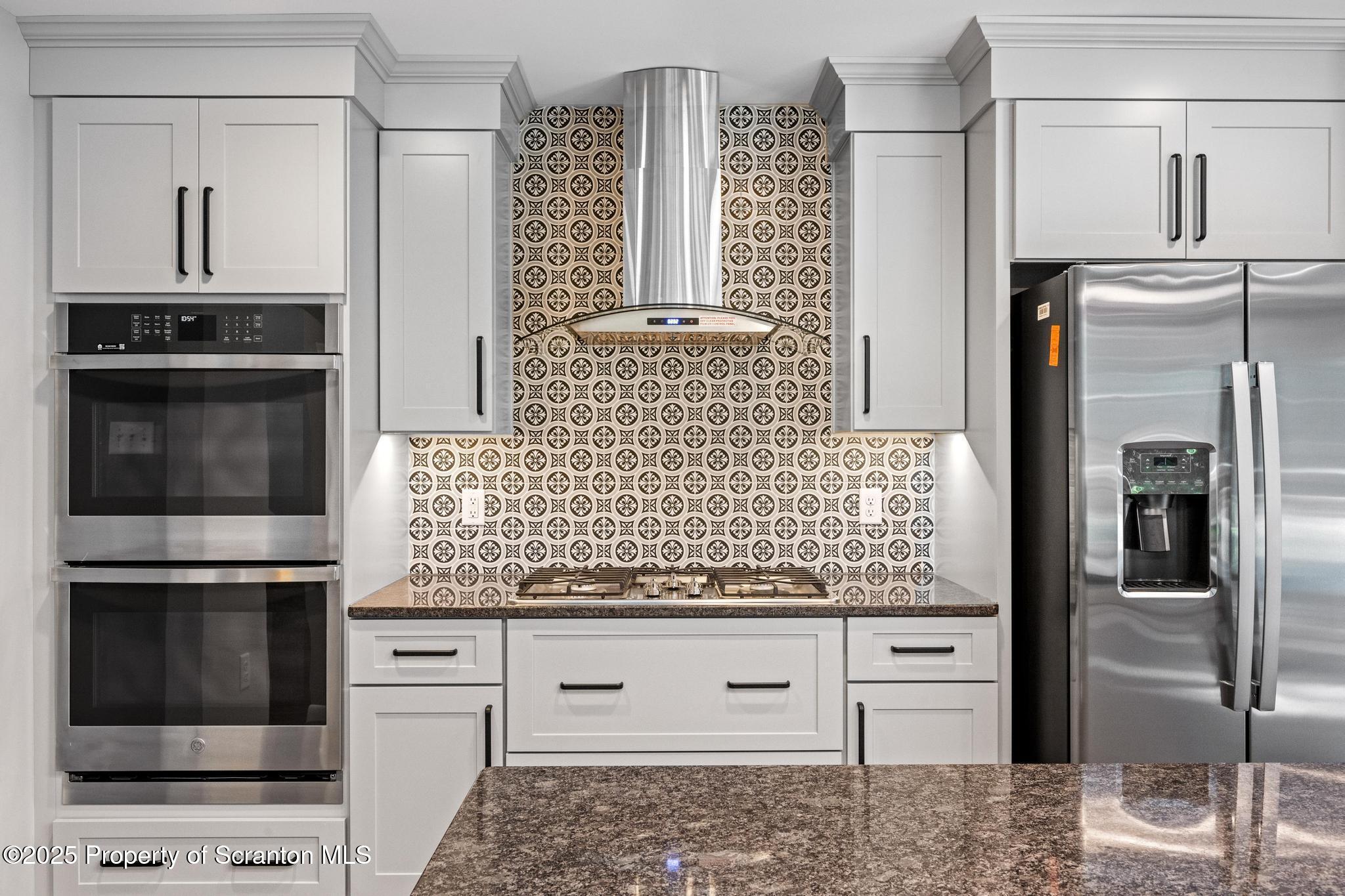 2001 Cleveland Avenue Scranton, PA 18505 - Photo 16 of 87 a kitchen with stainless steel appliances kitchen island granite countertop a refrigerator and a stove