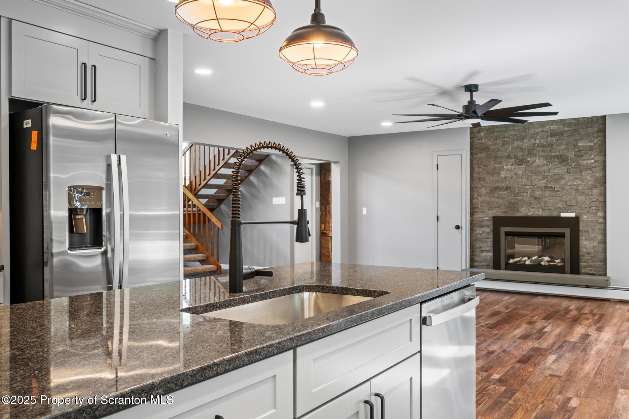 2001 Cleveland Avenue Scranton, PA 18505 - Photo 17 of 87 a kitchen with granite countertop a refrigerator a oven and a sink