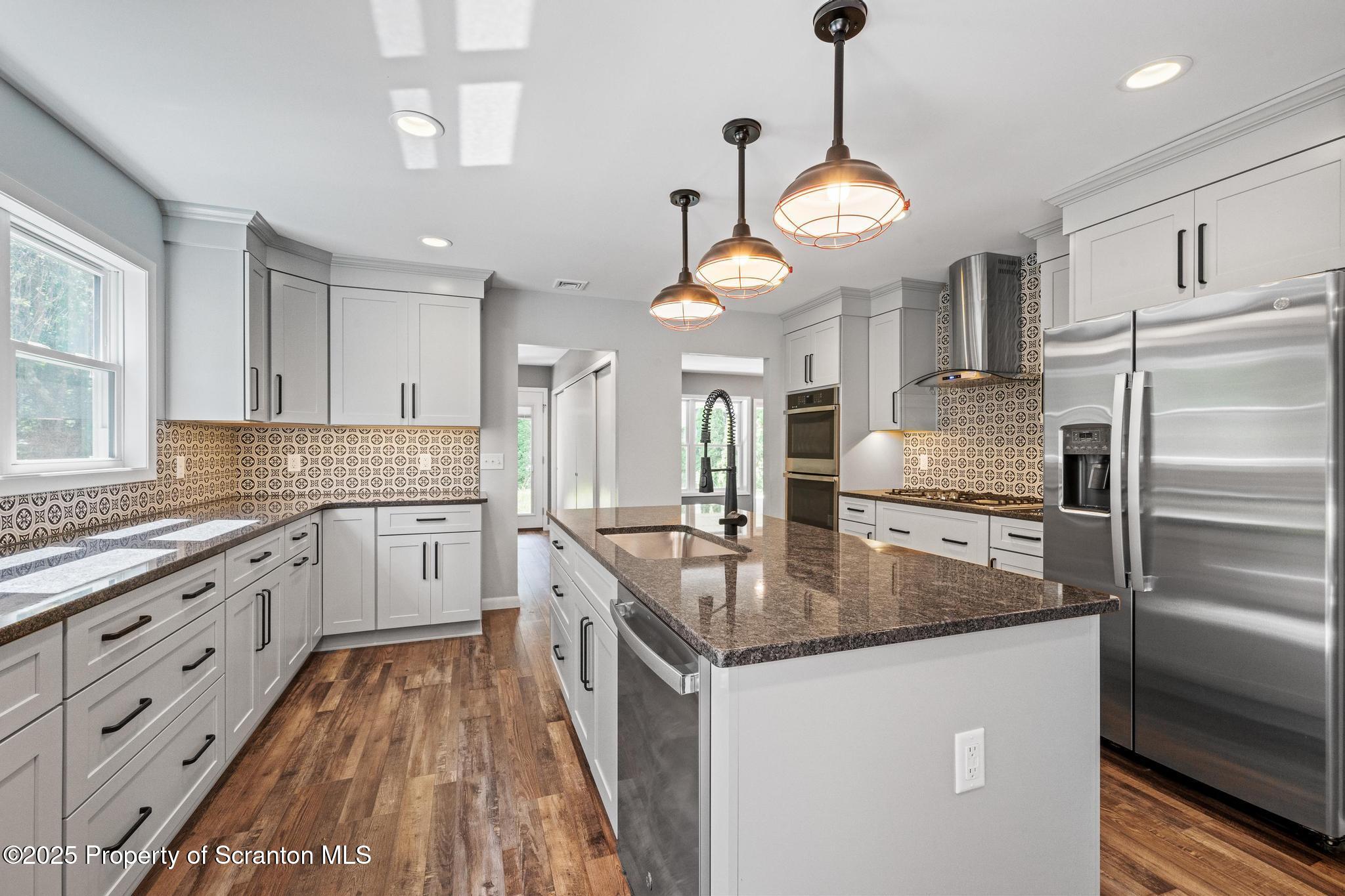 2001 Cleveland Avenue Scranton, PA 18505 - Photo 18 of 87 a kitchen with stainless steel appliances granite countertop a sink a stove and a refrigerator