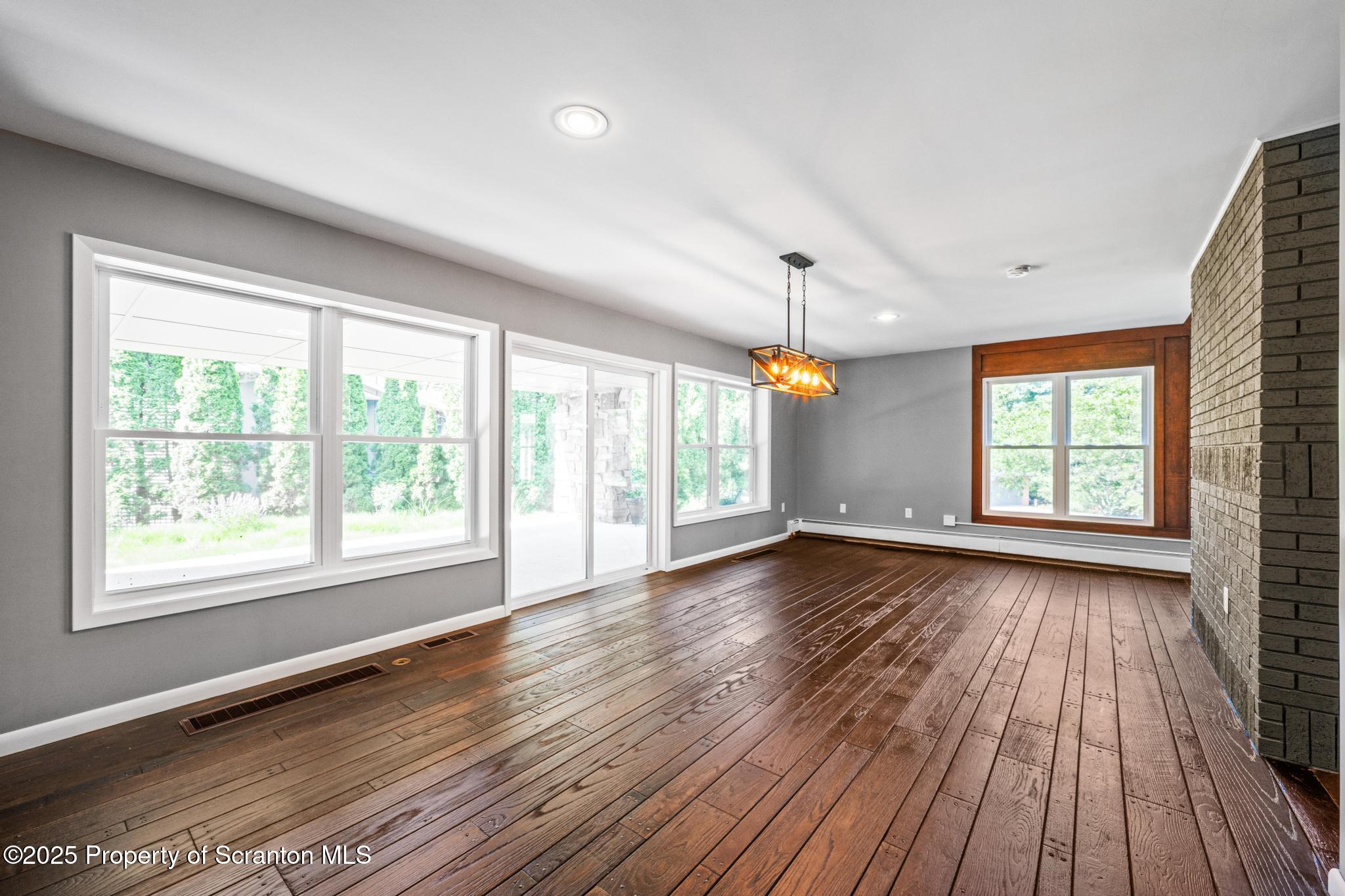 2001 Cleveland Avenue Scranton, PA 18505 - Photo 19 of 87 a view of an empty room with wooden floor and a window