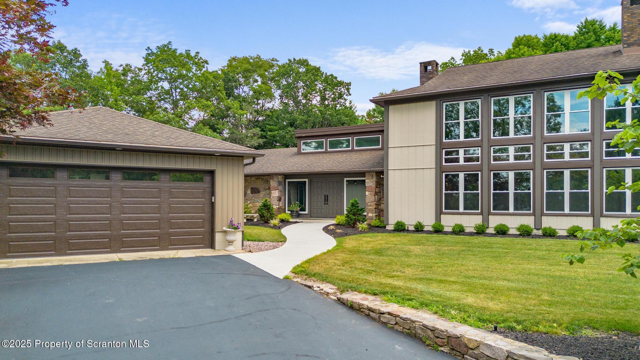 2001 Cleveland Avenue Scranton, PA 18505 - Photo 2 of 87 a front view of a house with a yard