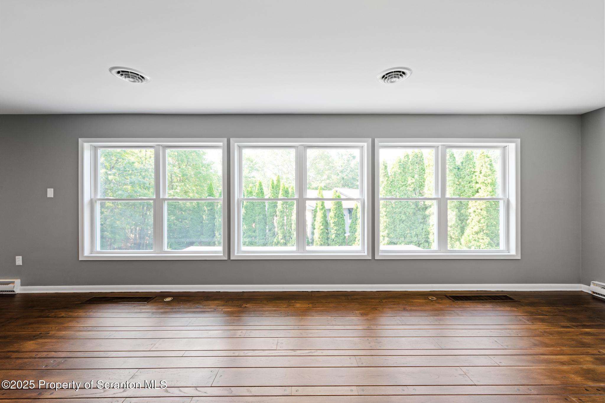 2001 Cleveland Avenue Scranton, PA 18505 - Photo 27 of 87 a view of empty room with wooden floor and fan