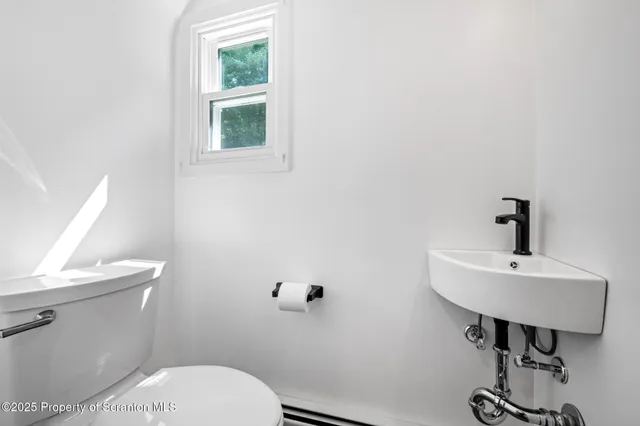 a bathroom with a shower and a sink