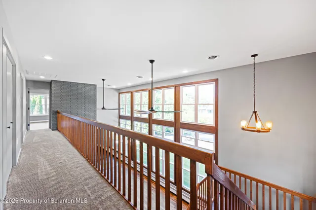 a view of a room with a ceiling fan