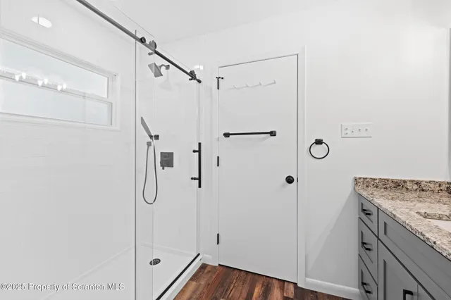 a kitchen with refrigerator and window