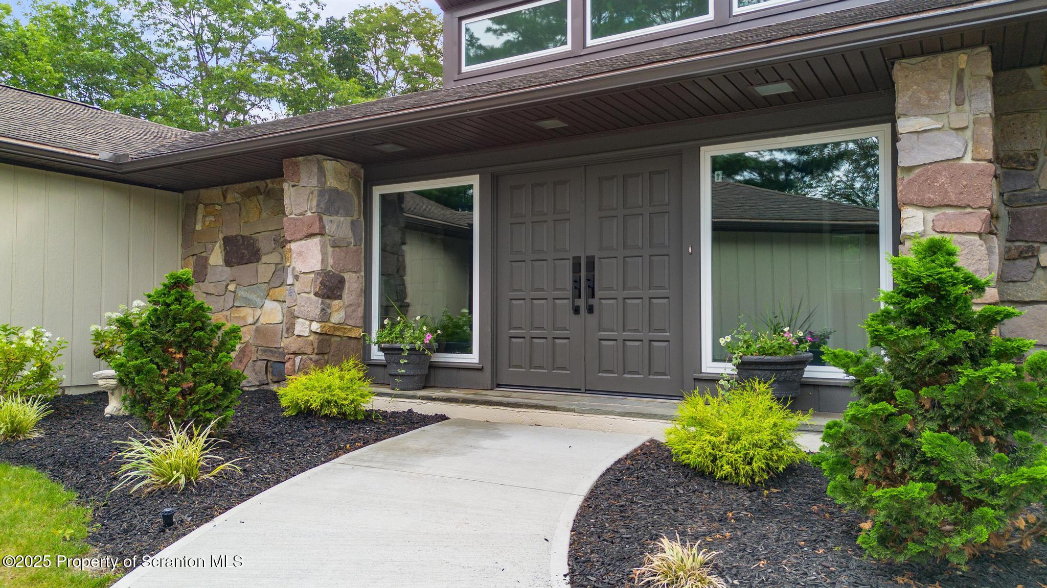 2001 Cleveland Avenue Scranton, PA 18505 - Photo 4 of 87 a front view of a house with a garden