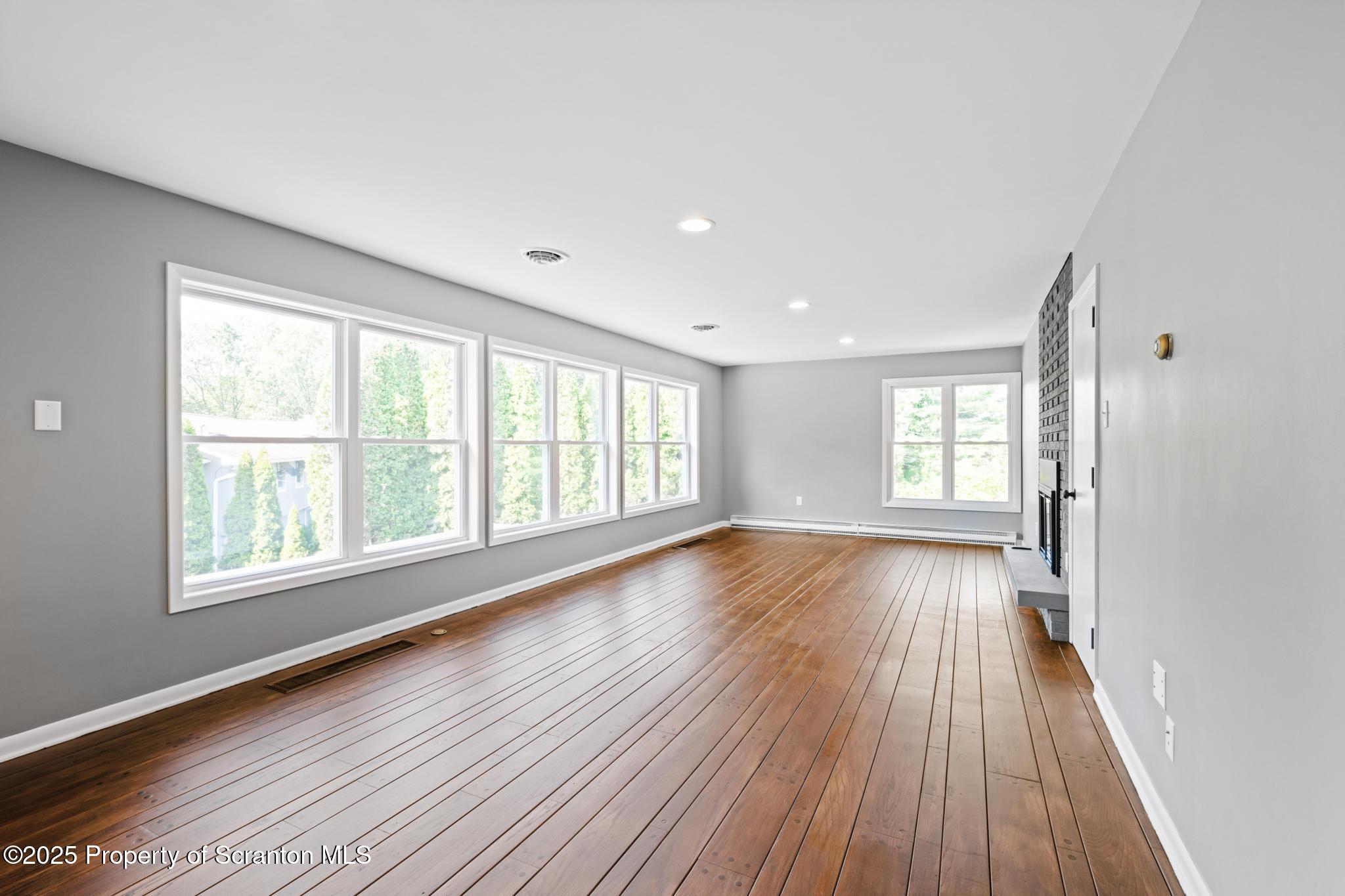 2001 Cleveland Avenue Scranton, PA 18505 - Photo 49 of 87 a view of an empty room with wooden floor and a window