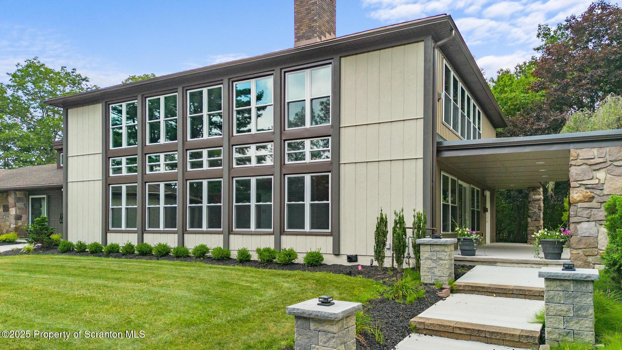 2001 Cleveland Avenue Scranton, PA 18505 - Photo 78 of 87 a front view of a house with a garden