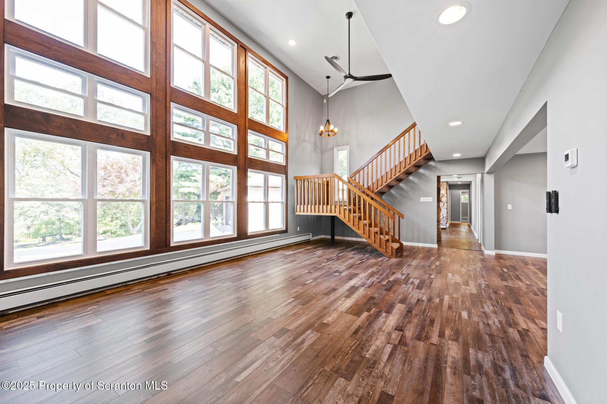 2001 Cleveland Avenue Scranton, PA 18505 - Photo 9 of 87 a view of an room with wooden floor staircase and windows