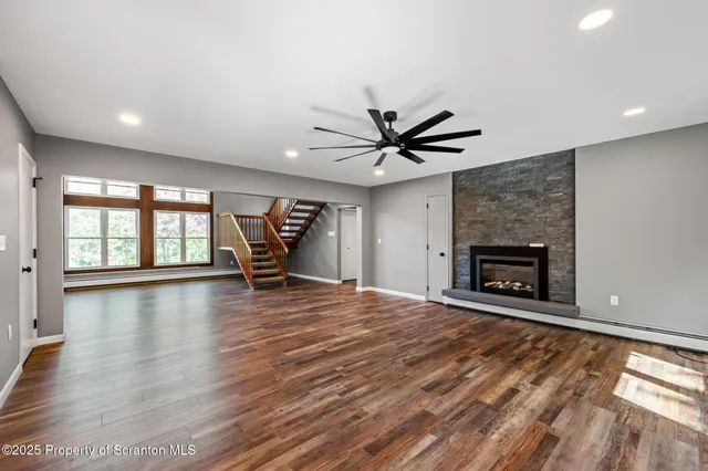 a kitchen with stainless steel appliances kitchen island granite countertop a refrigerator and a stove