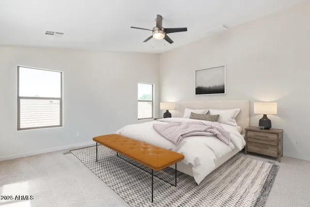 a bedroom with bed and a window