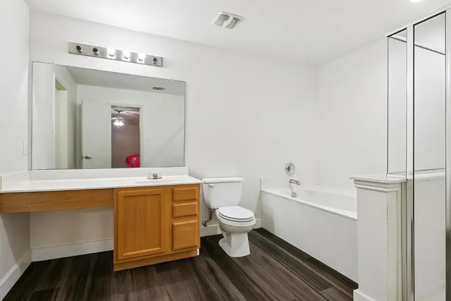 a bedroom with a bed and a mirror