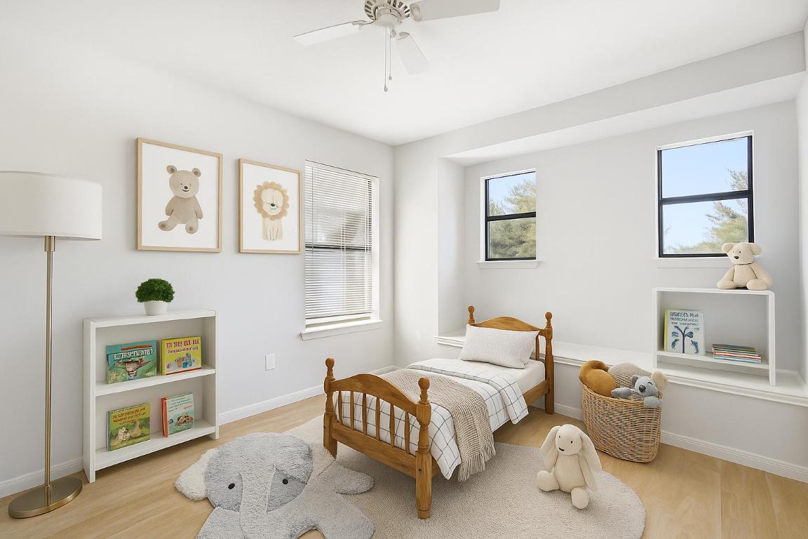 6605 Quinton Drive Austin, TX 78747 - Photo 13 of 19 a bedroom with furniture and a window