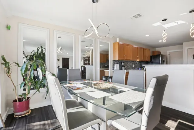 a kitchen with stainless steel appliances granite countertop a refrigerator sink and cabinets