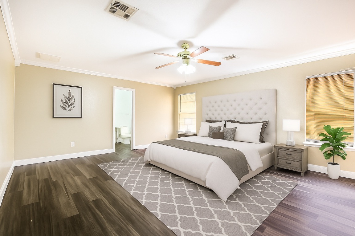 6605 Quinton Drive Austin, TX 78747 - Photo 10 of 19 a bedroom with a bed and a chandelier