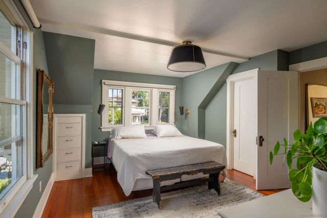 a bed room with a bed and a chandelier