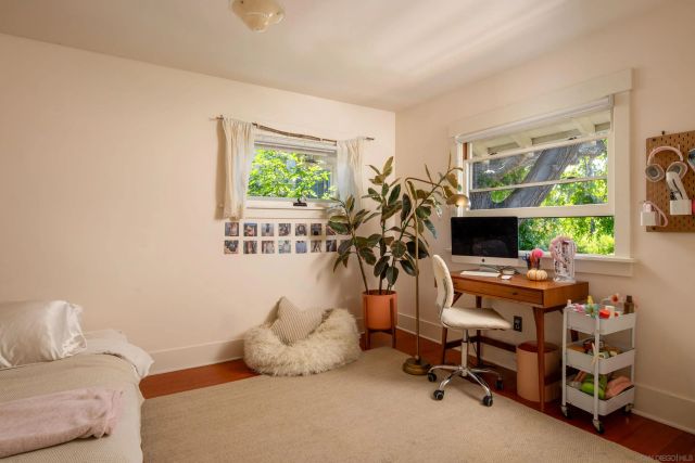 a workspace with furniture and a flat screen tv