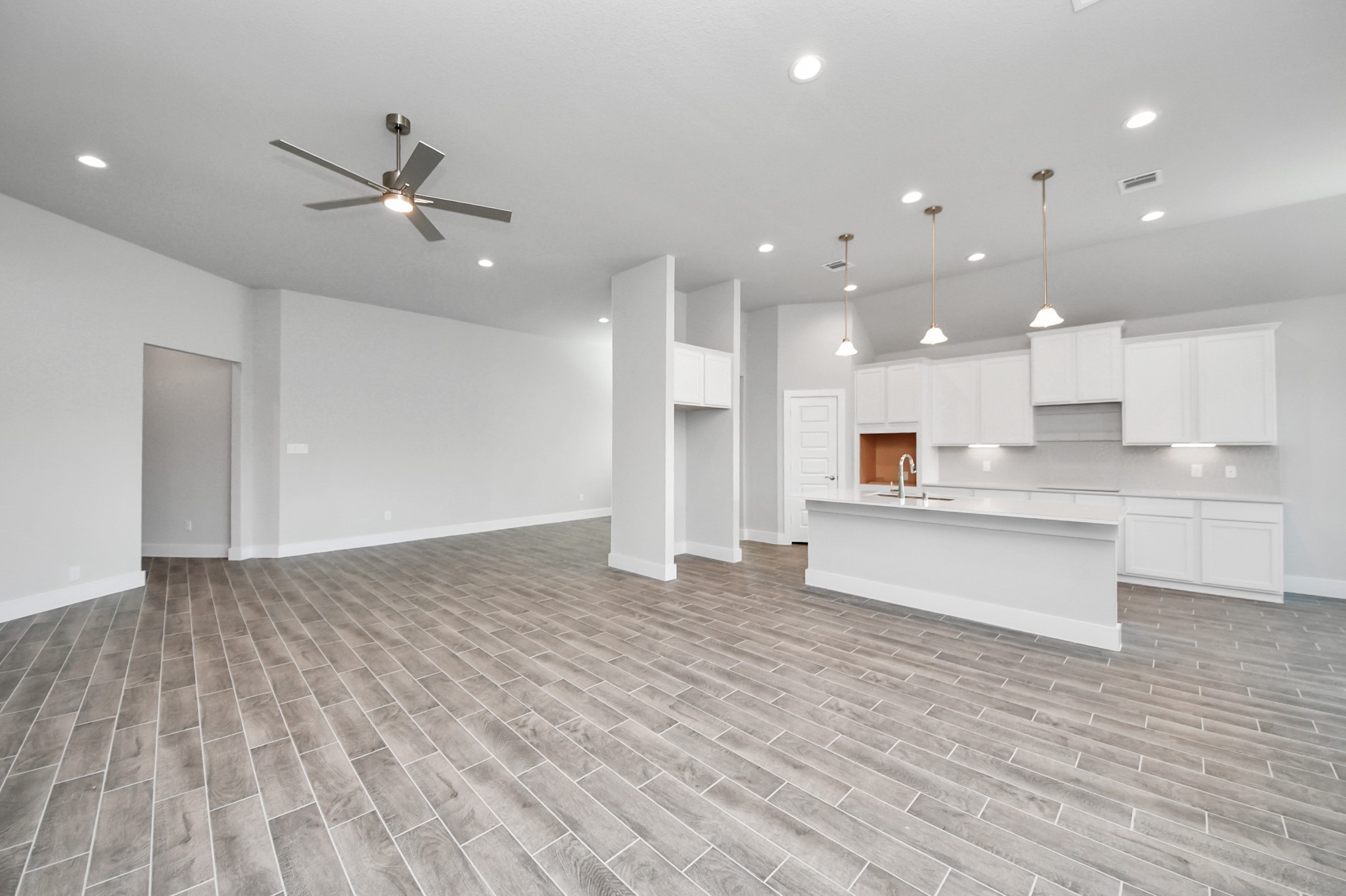 3121 Skerne Spring Dr Spring Spring, TX 77373 - Photo 28 of 44 Gather the family and guests together in your lovely living room! Featuring soaring high ceilings, recessed lighting, ceiling fan, custom paint, gorgeous floors, and large windows that provide plenty of natural lighting throughout the day.