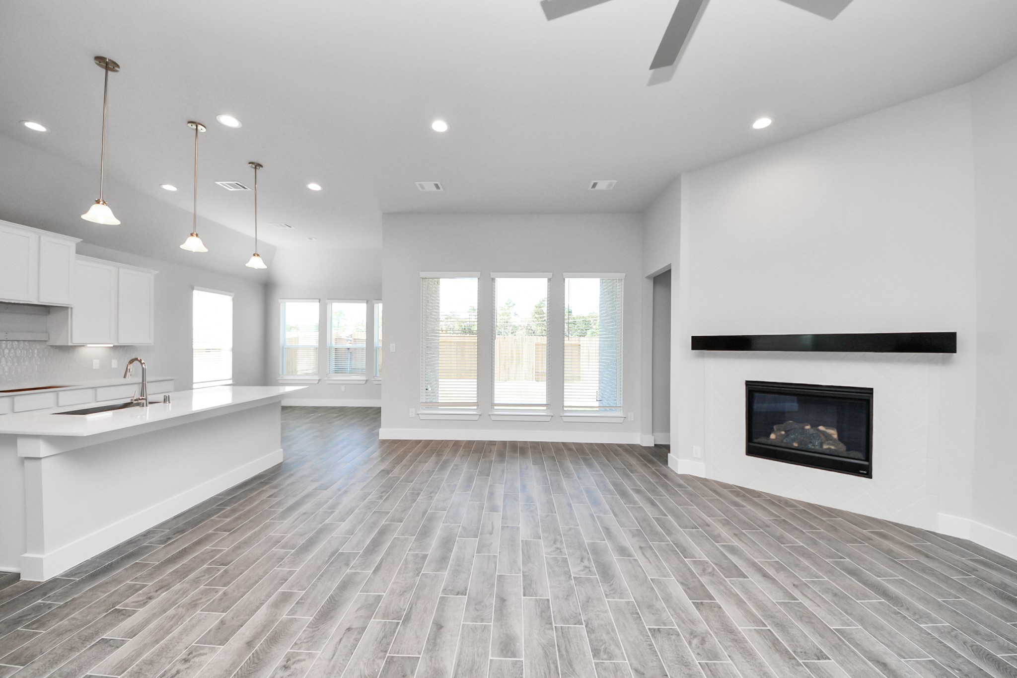 3121 Skerne Spring Dr Spring Spring, TX 77373 - Photo 29 of 44 Take another glimpse into the heart of the home with this additional view of the family room—a sprawling space ready to accommodate all your gatherings.