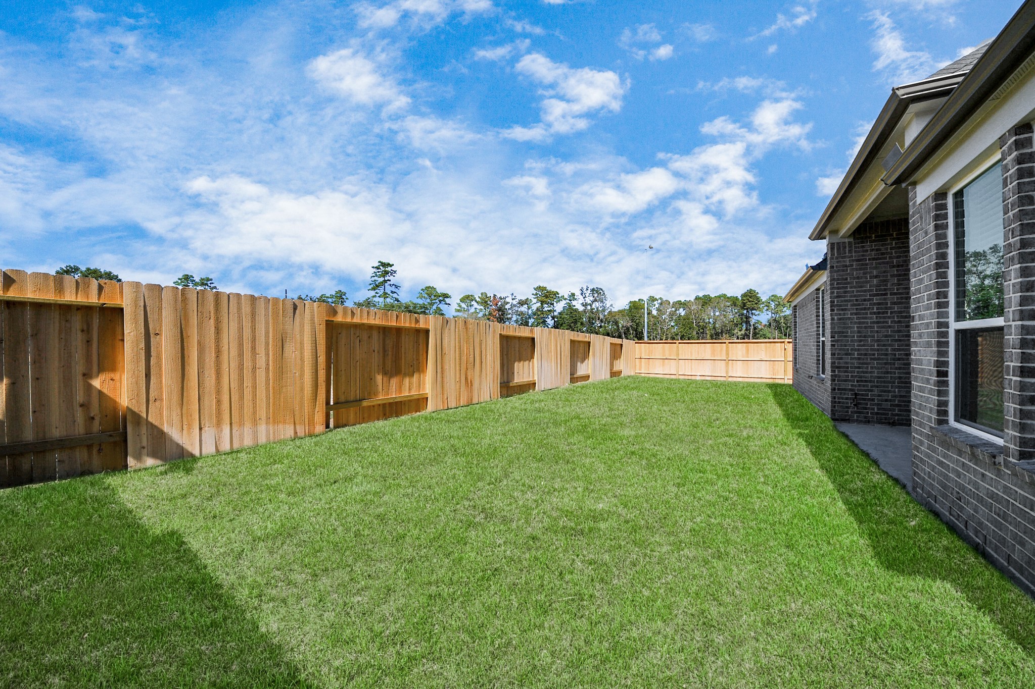 3121 Skerne Spring Dr Spring Spring, TX 77373 - Photo 39 of 44 Come and see this spacious backyard with its beautiful covered patio. There is plenty of room for the kids to play and adults to relax. Perfect for your outdoor living space, patio furniture, bbq pit, and so much more. The possibilities are endless!