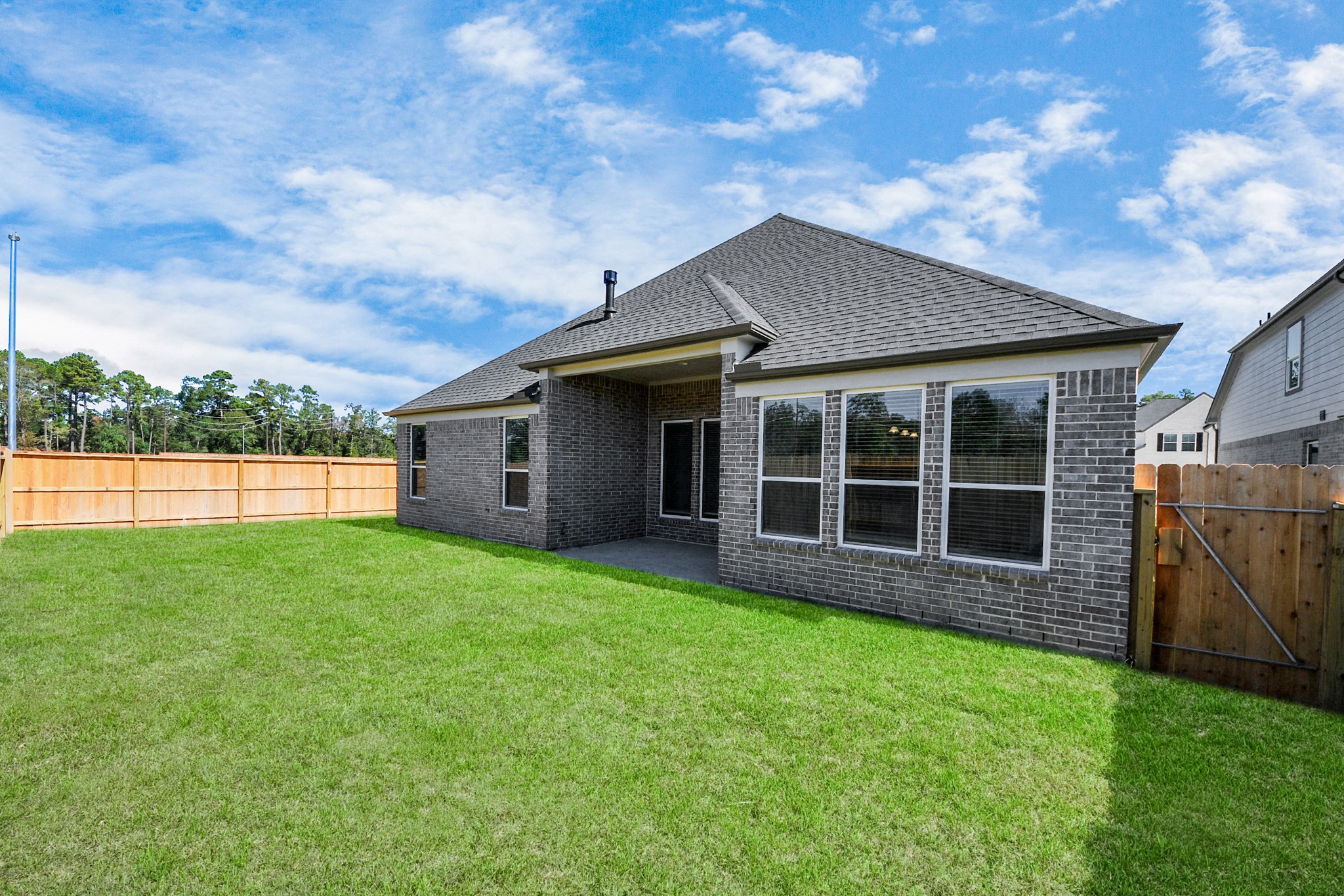 3121 Skerne Spring Dr Spring Spring, TX 77373 - Photo 41 of 44 Backyard retreat, offering an abundance of space for kids to play and explore. The possibilities are endless in this outdoor haven, where the joy of open-air activities and family gatherings awaits.