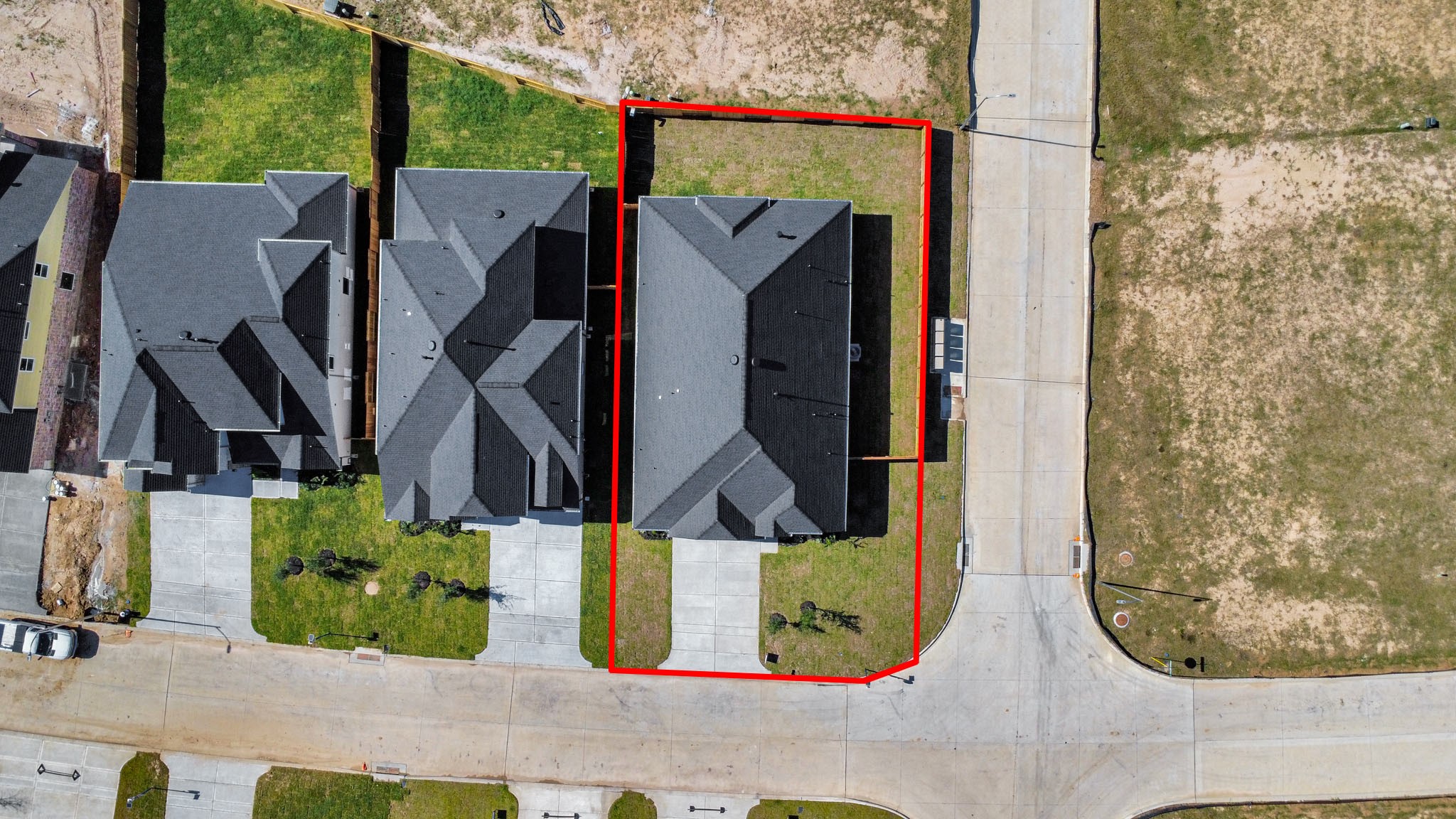 3121 Skerne Spring Dr Spring Spring, TX 77373 - Photo 5 of 44 An aerial view of a spacious subdivision lot, highlighting a well-maintained yard and a fully fenced perimeter, offering both privacy and expansive outdoor space.
