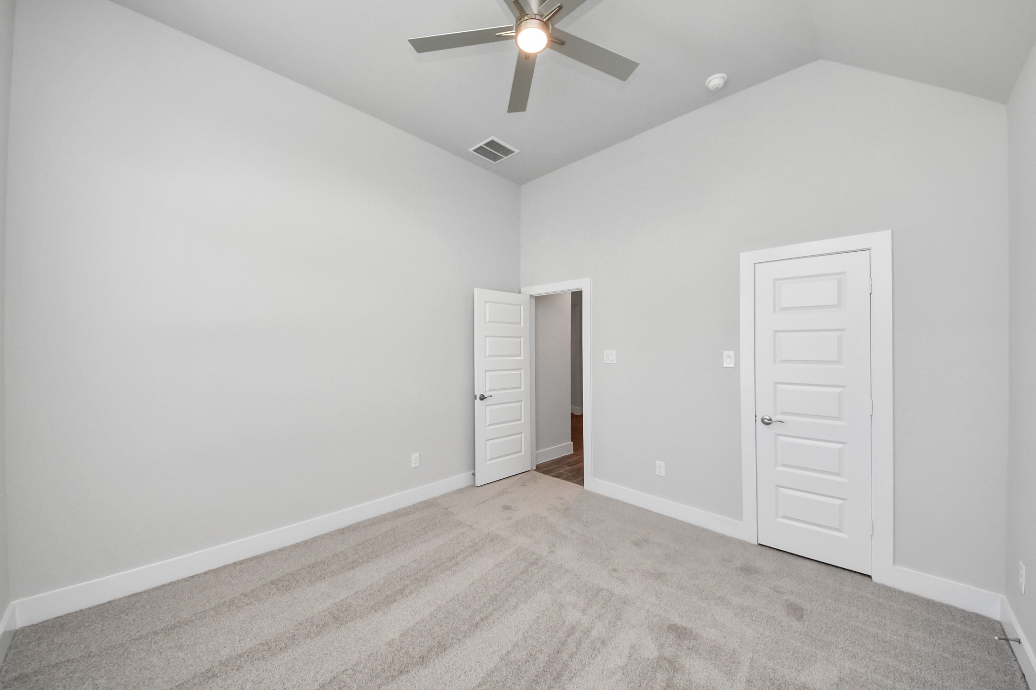3121 Skerne Spring Dr Spring Spring, TX 77373 - Photo 7 of 44 Generously sized secondary bedrooms featuring spacious closets, soft and inviting carpeting underfoot, large windows allowing plenty of natural light, and the added touch of privacy blinds for your personal retreat.