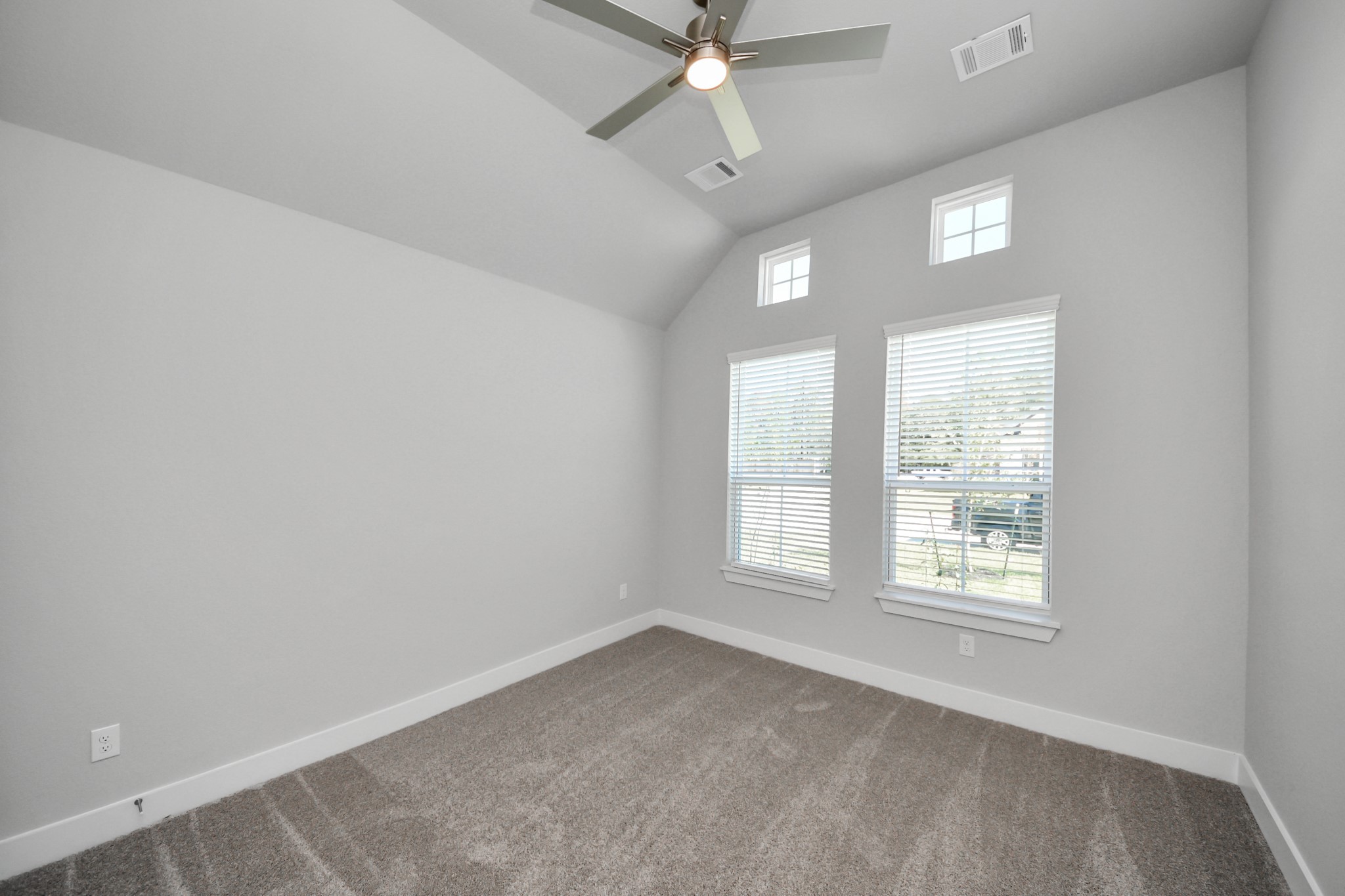 3121 Skerne Spring Dr Spring Spring, TX 77373 - Photo 8 of 44 Secondary bedroom features plush carpeting, large windows that let in plenty of natural light, bright paint, and spacious closets.