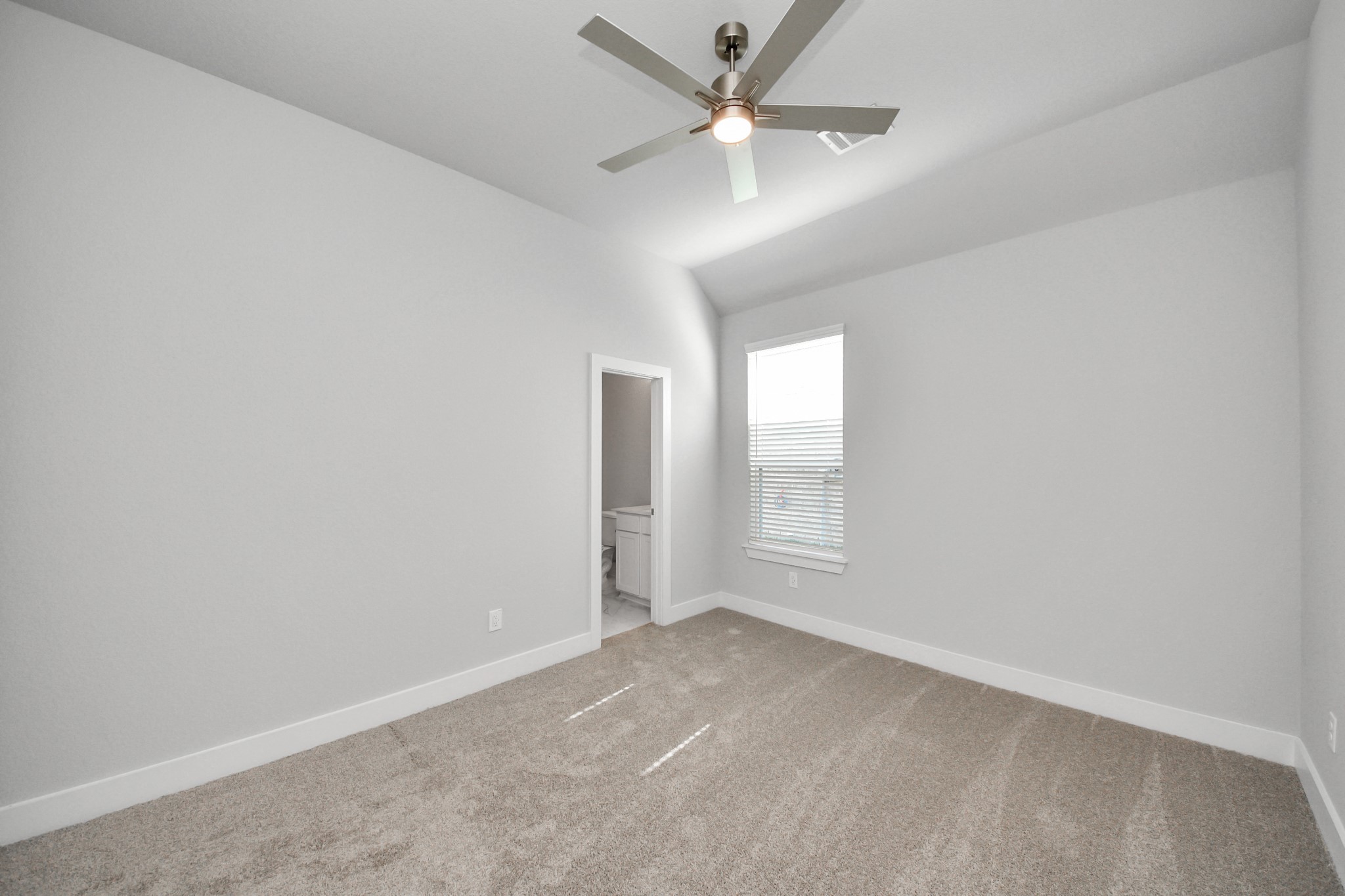 3121 Skerne Spring Dr Spring Spring, TX 77373 - Photo 10 of 44 Generously sized secondary bedrooms featuring spacious closets, soft and inviting carpeting underfoot, large windows allowing plenty of natural light, and the added touch of privacy blinds for your personal retreat.