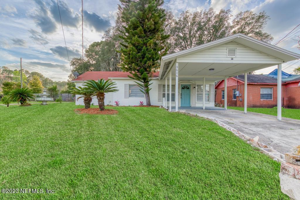 3616 Freeman Road Jacksonville, FL 32207 - Photo 11 of 41 a front view of a house with garden