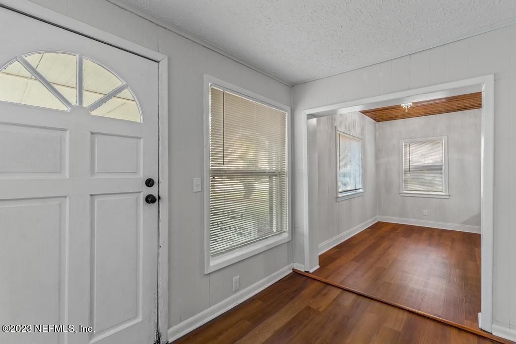 3616 Freeman Road Jacksonville, FL 32207 - Photo 14 of 41 wooden floor in an empty room with a window