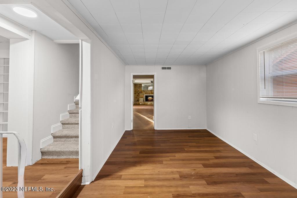 3616 Freeman Road Jacksonville, FL 32207 - Photo 16 of 41 a view of a hallway with wooden floor and entryway
